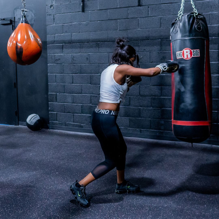 Women punching a punching bag