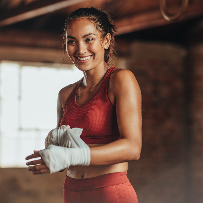 Women smiling while boxing