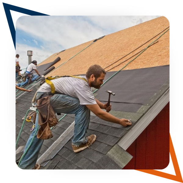 Roofers installing shingles