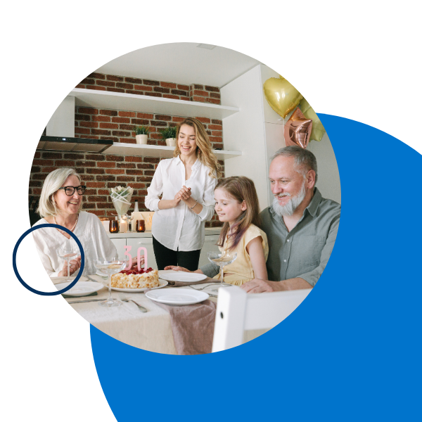family around a table celebrating a birthday