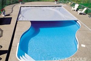 Drone shot of pool cover in backyard