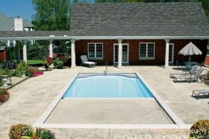 Half of a pool cover draped onto a pool