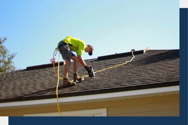 Roofer doing maintenance on a residential roof