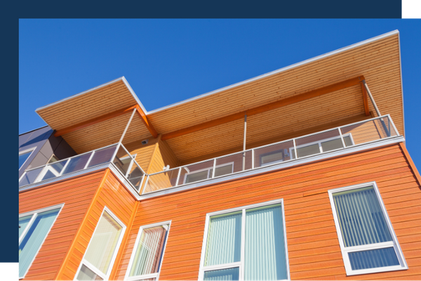Looking up at a roof of an apartment building Looking up at a roof of an apartment building