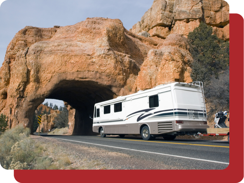 RV driving through a rock formation