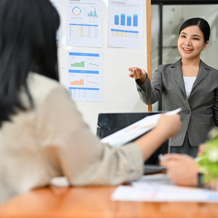 Woman presenting financial documents. 