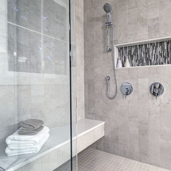 shower with alcoves and bench