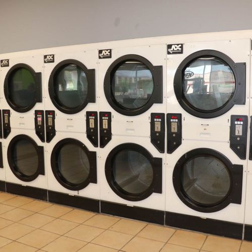 a wall of washing machines