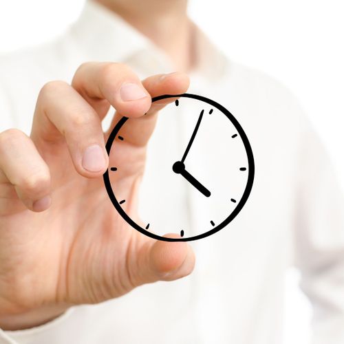 person holding a clock