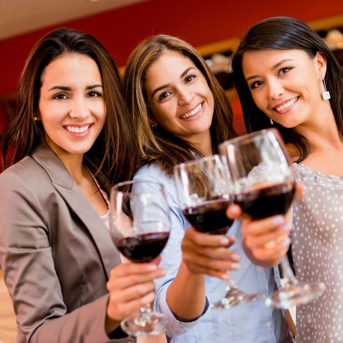 women cheering with wine