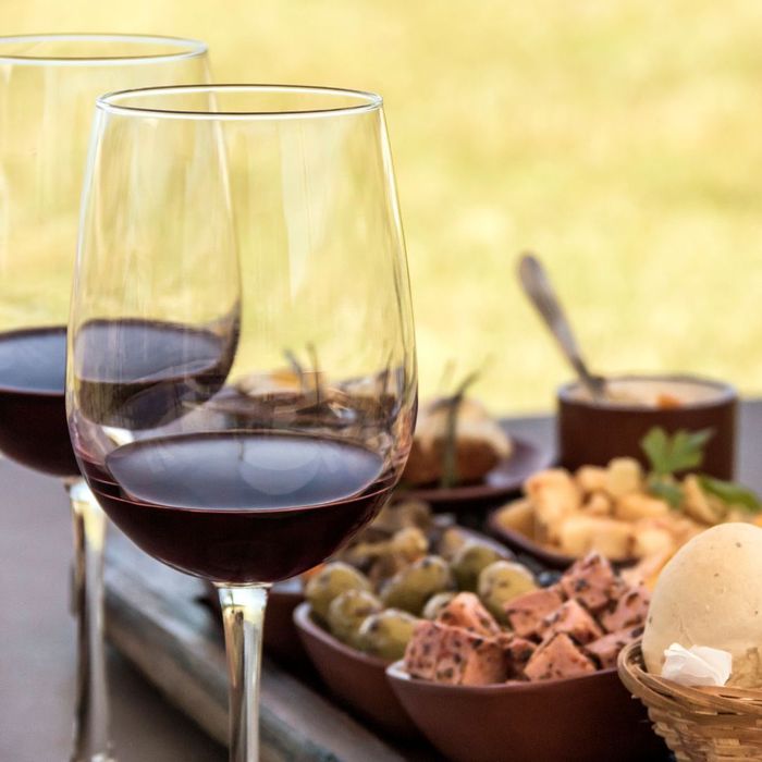 up close of wine glasses and charcuterie 