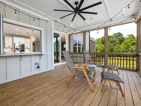 A nice deck with patio furniture on it