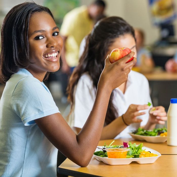 a teen enjoying a healthy school lunch