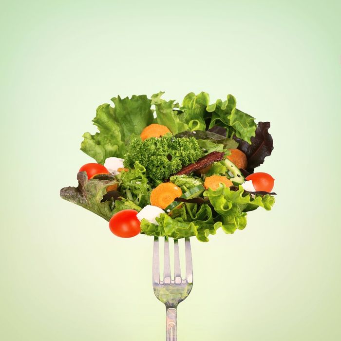A fork full of salad.