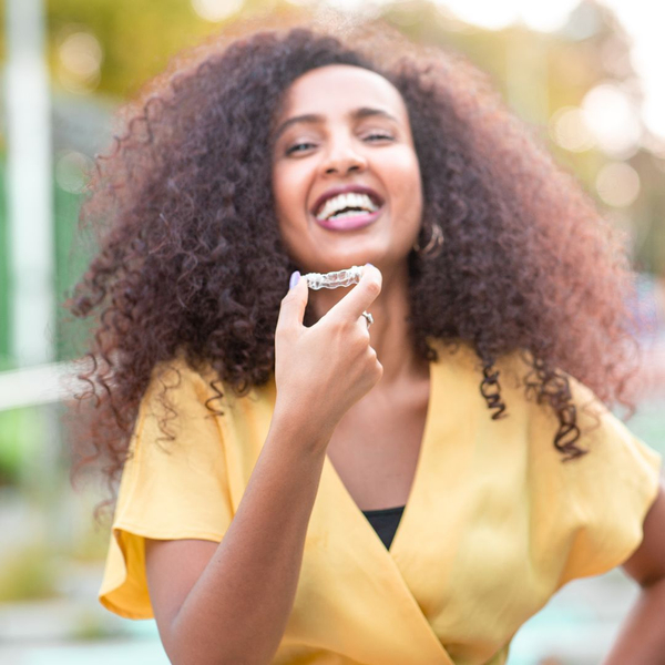 woman with clear aligners