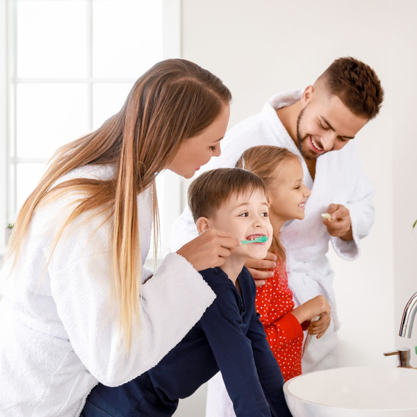 family brushing teeth