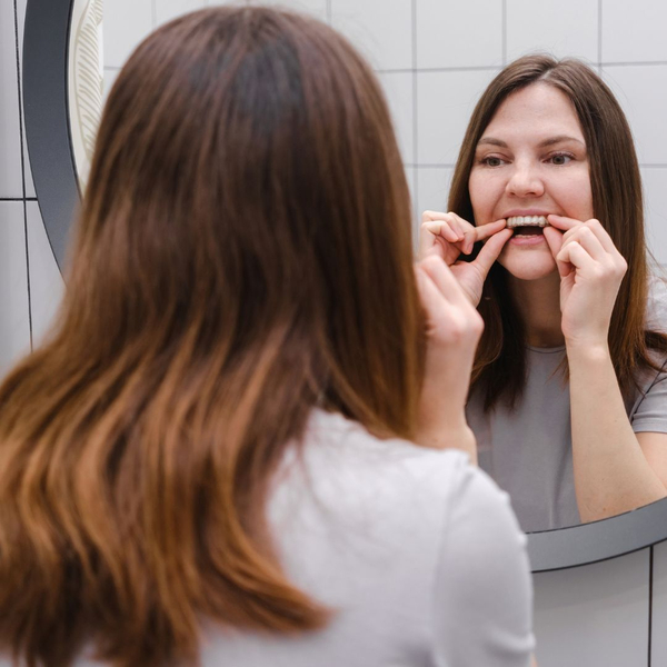 woman with clear aligners