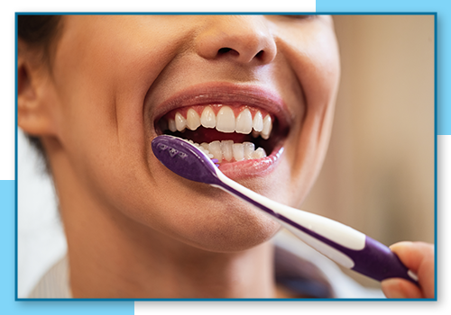 Image of a woman brushing her teeth