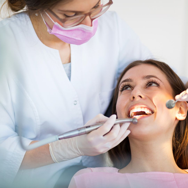 woman smiling at dental assistant