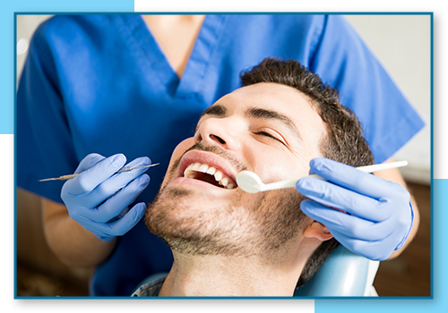 image of a man getting dental cleaning