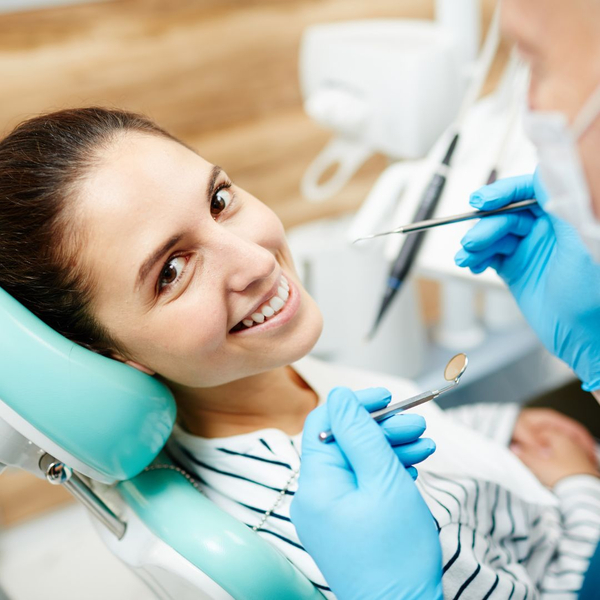 smiling in dentist chair