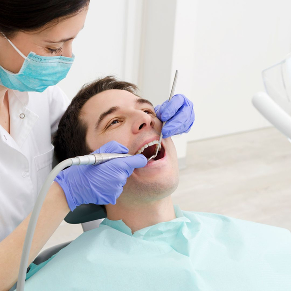man undergoing dental exam