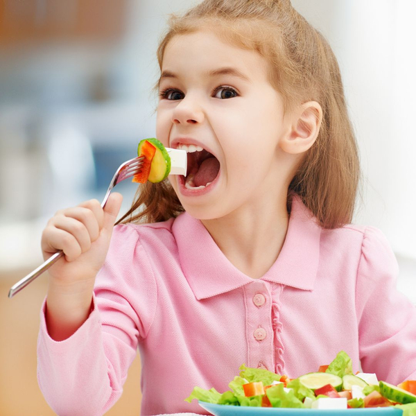 girl eating vegetables