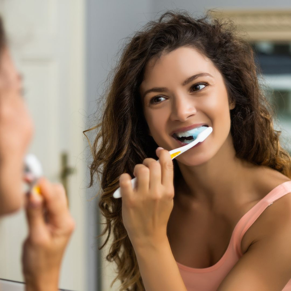 lady brushing her teeth