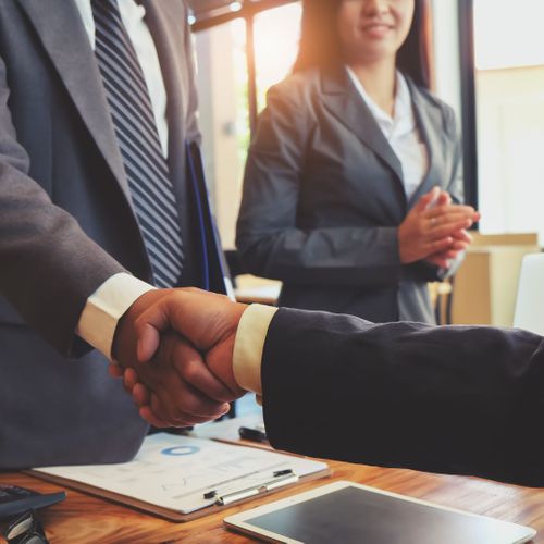 shaking hands with businessman shaking hands with businessman