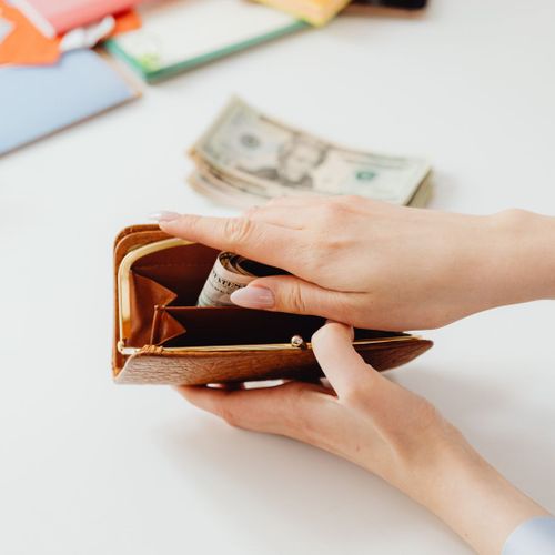 putting money in wallet putting money in wallet