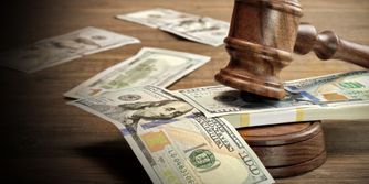 stack of money and a gavel