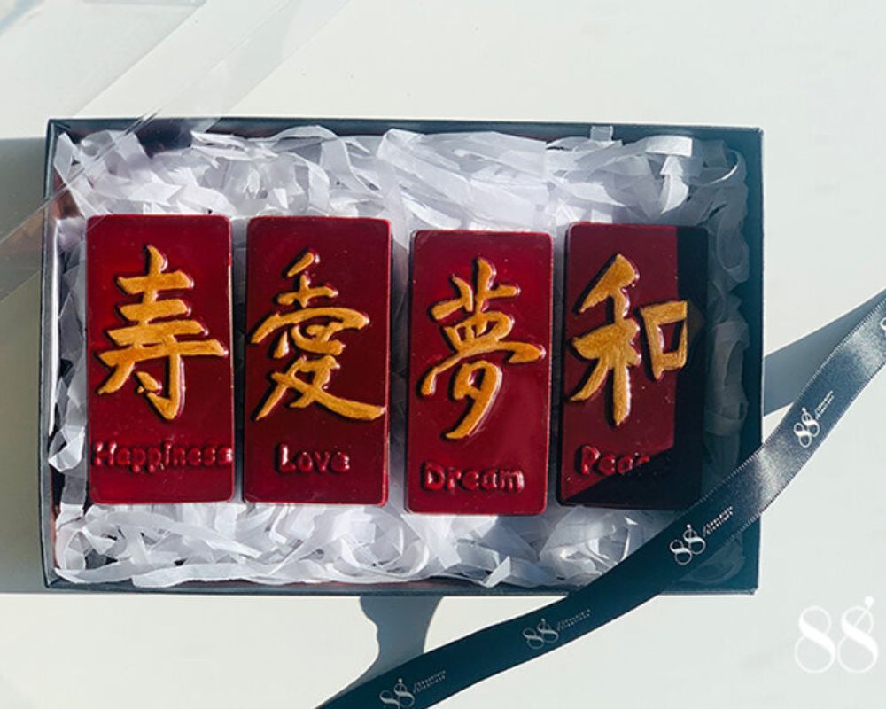 bars of chocolate with Chinese symbols for the Chinese New Year in red and gold