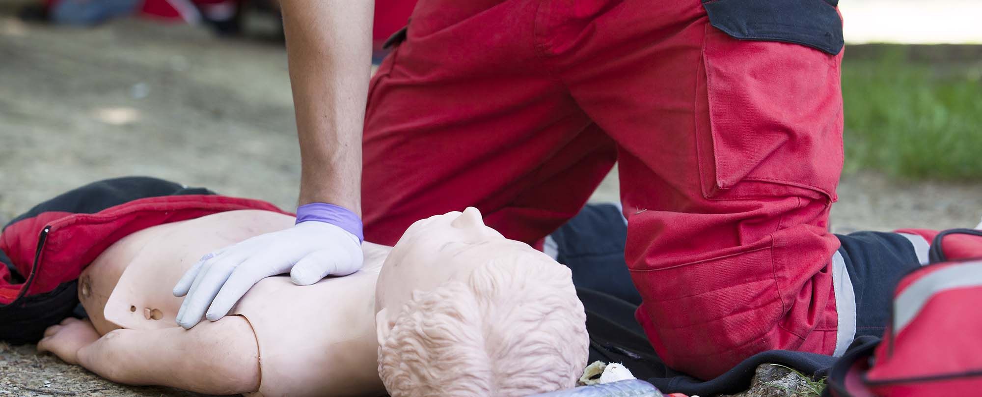 Image of a person teaching CPR on a dummy