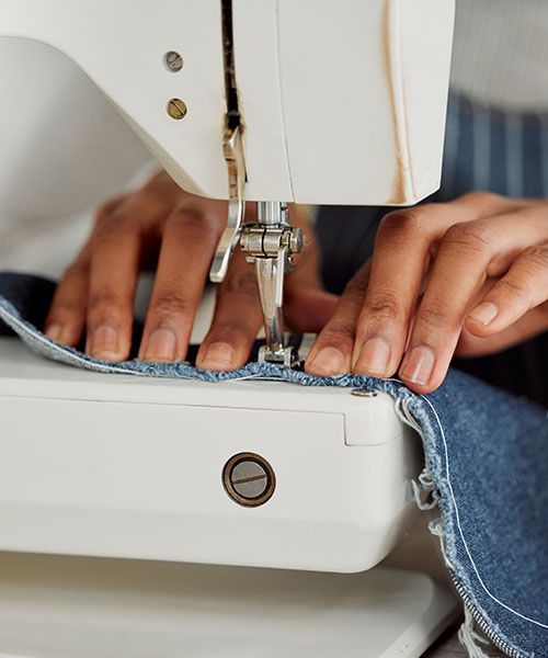 Person using a sewing machine