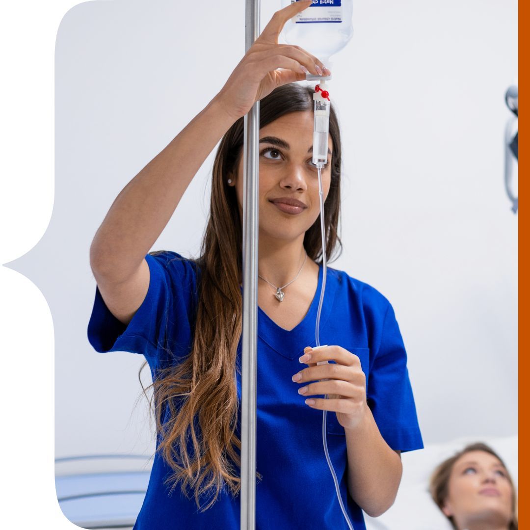 nurse setting up IV drip