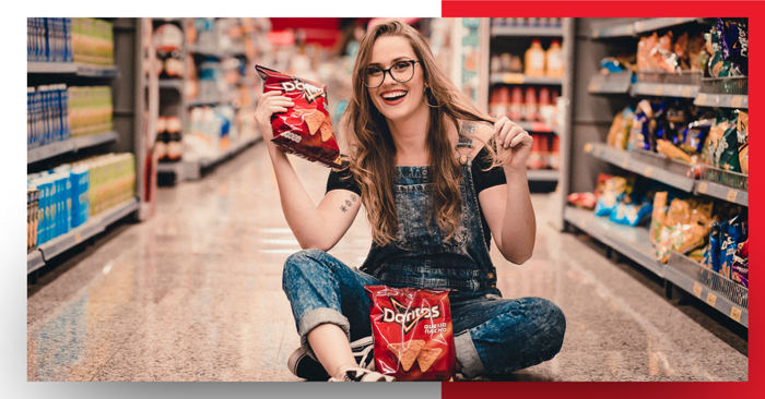 Woman holding a bag of chips