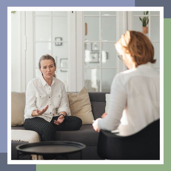 A woman speaking with a therapist