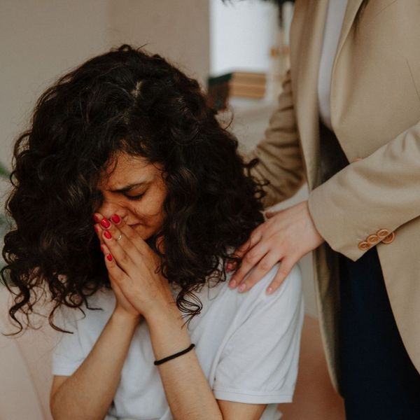 Counselor comforting a sad woman