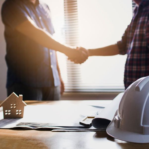 homeowner with home renovation contractor homeowner with home renovation contractor