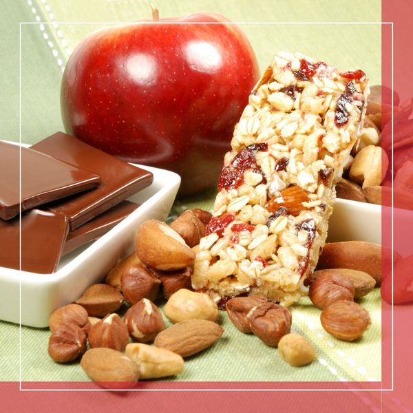 apples, nuts, a granola bar, and chocolate