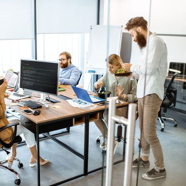 employees eating at their desks