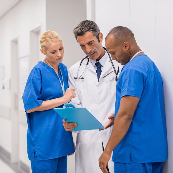 doctors looking at a clipboard