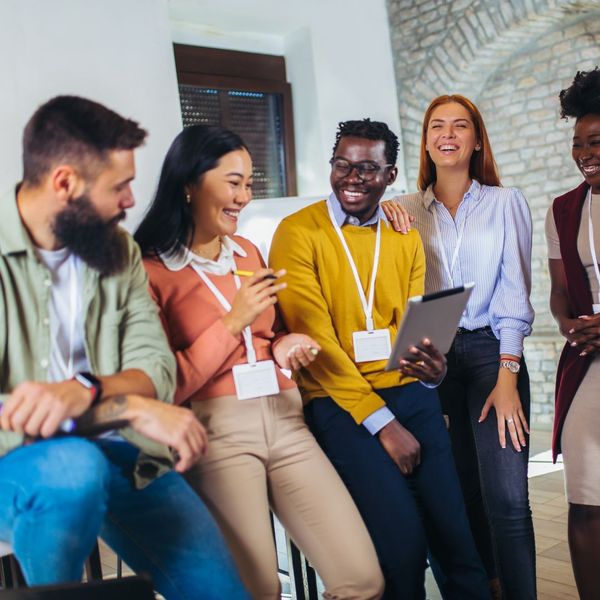 employees smiling and talking