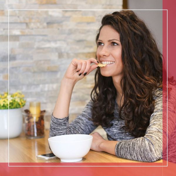 woman snacking on chips