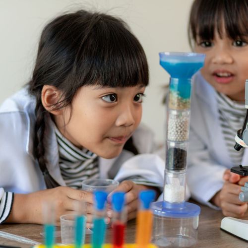 child looking at lab equipment