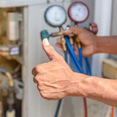 image of an HVAC Technician giving a thumbs up