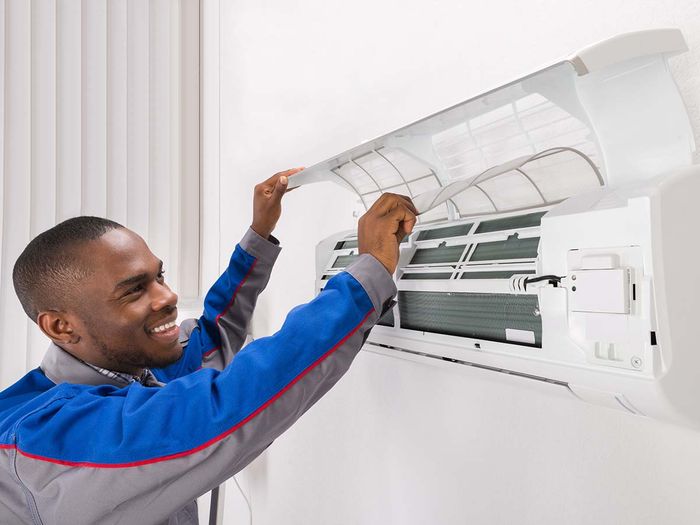 Man installing an AC unit