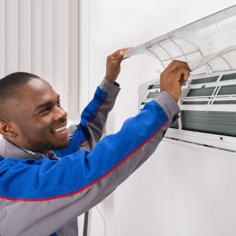 repairman working on mini split