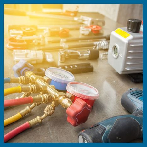 HVAC equipment and parts laid out on a table