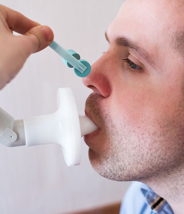 man performing a breath test